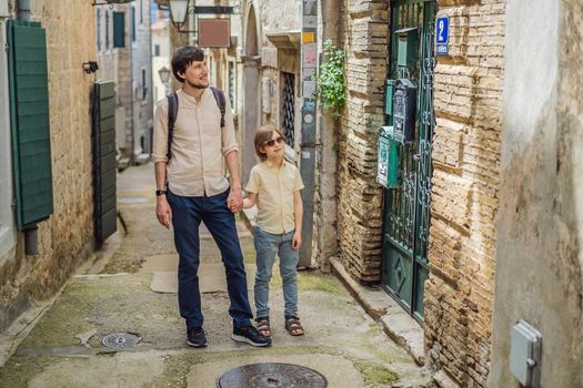 Father and son tourists in Herceg Novi old town. Historical and touristic center of Herceg Novi. Montenegro.