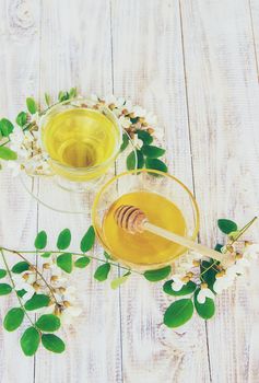 Honey with acacia and tea. Selective focus.