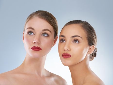 Staying forever beautiful. Studio beauty shot of a two young models