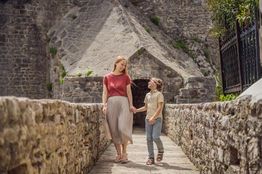 Mom and son tourists in Herceg Novi old town. Historical and touristic center of Herceg Novi. Montenegro.