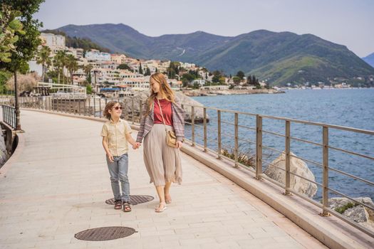 Mom and son tourists in Herceg Novi old town. Historical and touristic center of Herceg Novi. Montenegro.