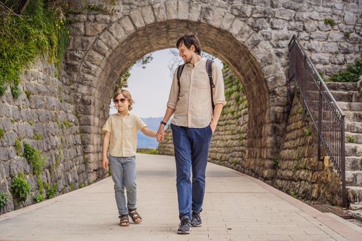 Father and son tourists in Herceg Novi old town. Historical and touristic center of Herceg Novi. Montenegro.