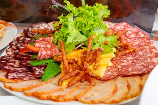 plate with meat sliced decorated salad.