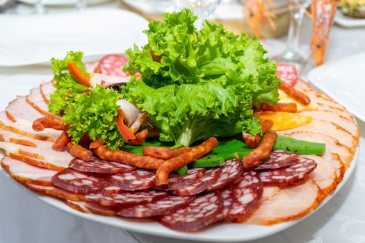Meat slices decorated with salad.