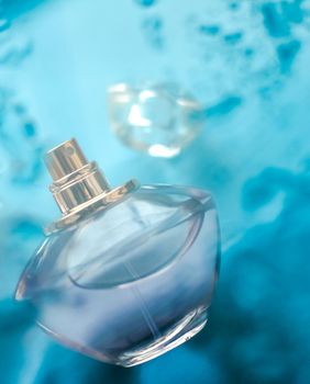 Perfumery, cosmetics and branding concept - Perfume bottle under blue water, fresh sea coastal scent as glamour fragrance and eau de parfum product as holiday gift, luxury beauty spa brand present