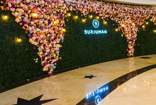 Dubai, UAE - 09.26.2022 - Flower wall installation in Burjman shopping mall