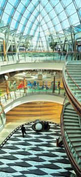 Dubai, UAE - 09.26.2022 - Staircase in the lobby of the Burjman shopping mall.