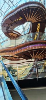 Dubai, UAE - 09.26.2022 - Staircase in the lobby of the Burjman shopping mall.