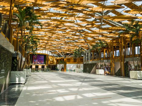 Dubai, UAE - 09.26.2022 - Hall with wooden ceiling installation in the Burjman shopping mall.