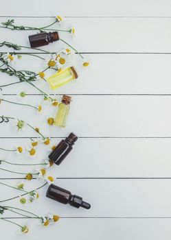 Chamomile extract in a small bottle. Selective focus.