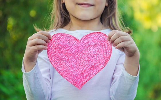 children have a heart in their hands. Selective focus.