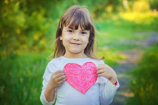 children have a heart in their hands. Selective focus.