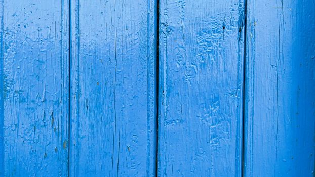 Old wood planks blue color background