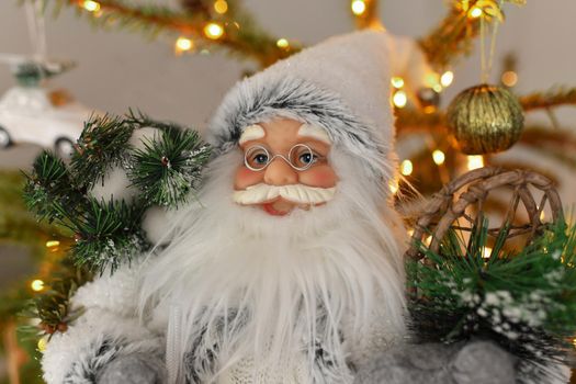 Christmas decorations Santa Claus standing under the Christmas tree