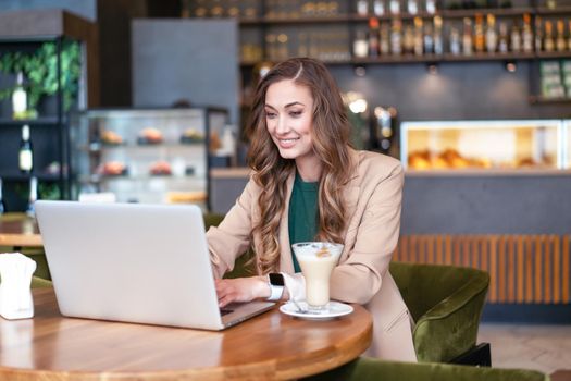 Business Woman Restaurant Owner Use Laptop In Hands Dressed Elegant Pantsuit Sitting Table In Restaurant With Bar Counter Background Caucasian Female Business Person Indoor