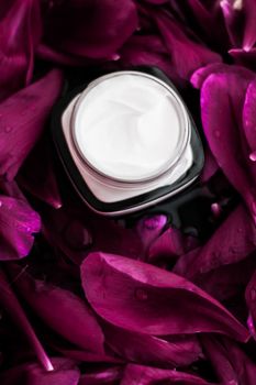 Clean beauty, cosmetic products and luxury body care concept - Sensitive skincare moisturizer cream on purple flower petals background, natural science for skin