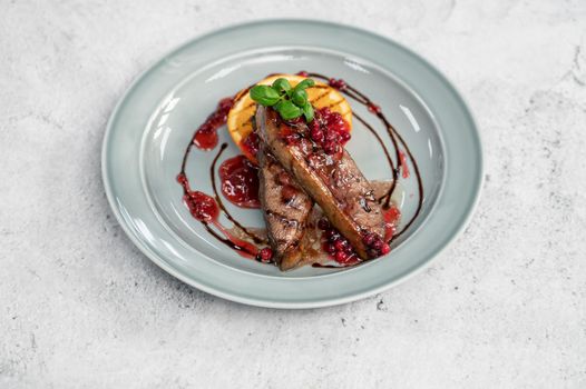 Tasty duck breast with orange and berries