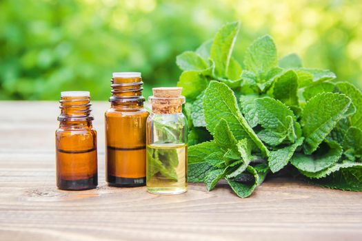 The mint extract in a small jar. Selective focus. nature.