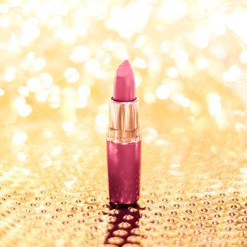 Cosmetic branding, sale and glamour concept - Rose lipstick on golden Christmas, New Years and Valentines Day holiday glitter background, make-up and cosmetics product for luxury beauty brand