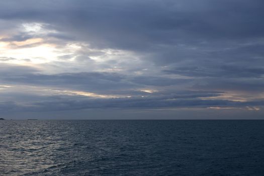 Calm sea with sunset sky with cloud