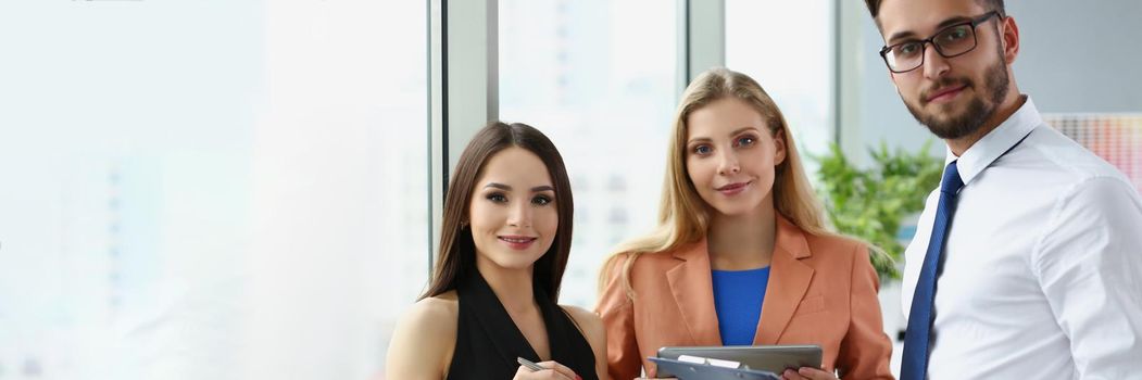 Portrait of confident team of successful people, men and women employees pose for collective picture. Coworkers in trendy suits. Business, teamwork concept