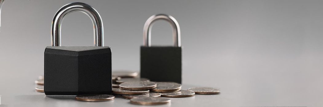 Close-up of combination padlock on coin money for financial security, symbol for protection finance. Keep savings in secure place. Security, safety concept