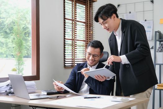 Two Business working at office with documents on desk, meeting to planning analyzing the financial report, business plan investment, finance analysis concept.