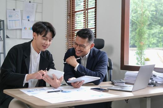 Two Business working at office with documents on desk, meeting to planning analyzing the financial report, business plan investment, finance analysis concept.