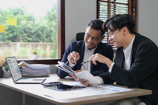 Two Business working at office with documents on desk, meeting to planning analyzing the financial report, business plan investment, finance analysis concept.