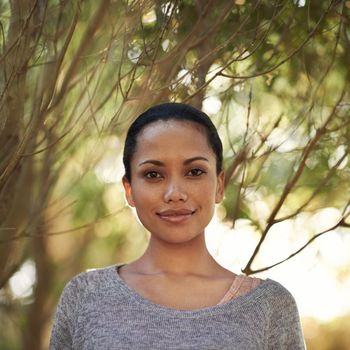 Loving the outdoors. Portrait of a confident young woman standing with her arms folded outdoors