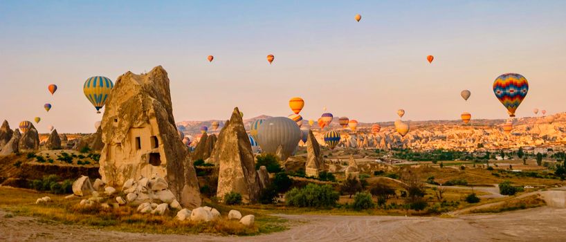 Sunrise with hot air balloons in Cappadocia, Turkey balloons in Cappadocia Goreme Kapadokya, and Sunrise in the mountains of Cappadocia with many hot air ballon in the sky