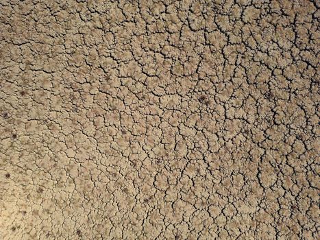 Dry and cracked lake bed due to global warming and drought