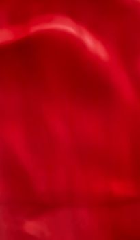 Holiday branding, beauty glamour and love backgrounds concept - Red abstract art background, silk texture and wave lines in motion for classic luxury design