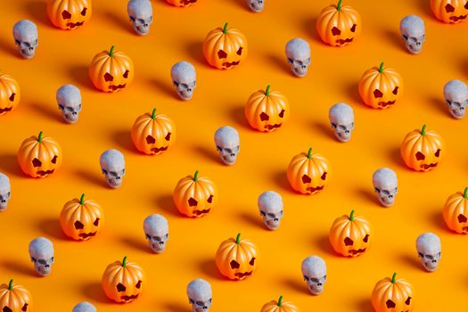 3d isometric render pattern of many Halloween pumpkin and white skulls on orange background