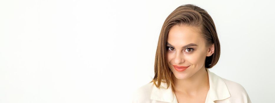 Portrait of a beautiful young caucasian smiling brunette woman on white background