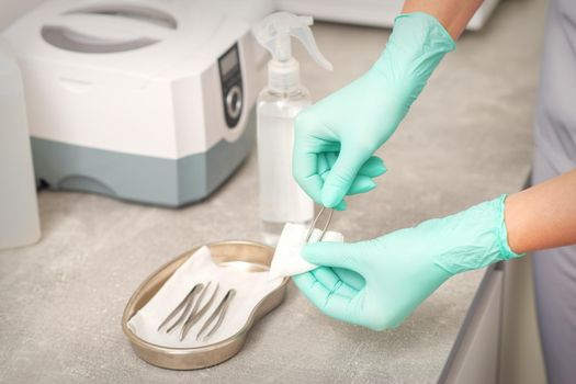 Hand disinfects tweezers with cleaning systems for medical instruments. Ultrasonic cleaner