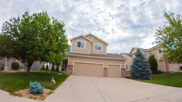 View of the typical suburban neighborhood on a summer morning.