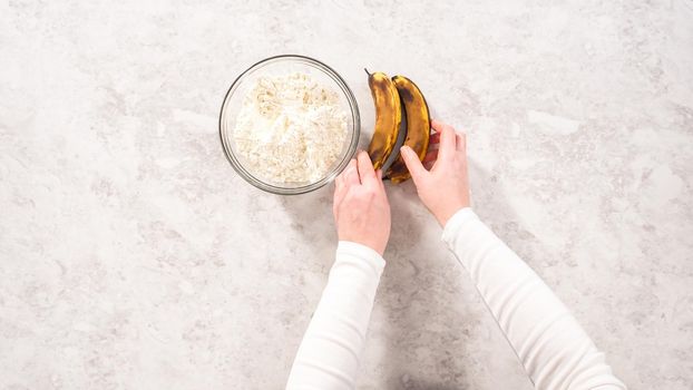 Flat lay. Step by step. Measured ingredients in glass mixing bowls to prepare coconut banana pancakes for breakfast.