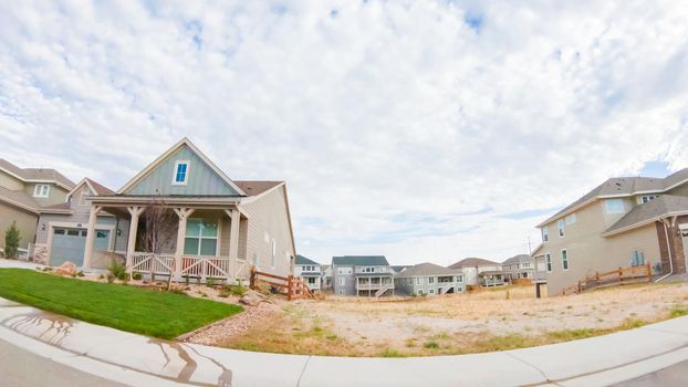 View of the typical suburban neighborhood on a summer morning.