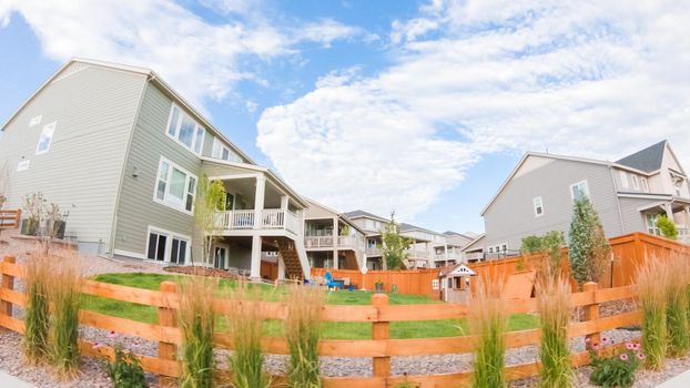 View of the typical suburban neighborhood on a summer morning.