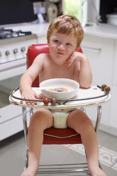 I wish someone would let me out...A bored toddler sitting in a high chair