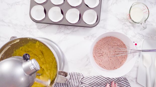 Flat lay. Step by step. Mixing ingredients in a standing kitchen mixer to bake red velvet cupcakes.