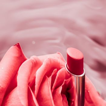 Cosmetic branding, luxe and fashion concept - Pink lipstick and rose flower on liquid background, waterproof glamour make-up and lip gloss cosmetics product for luxury beauty brand holiday design