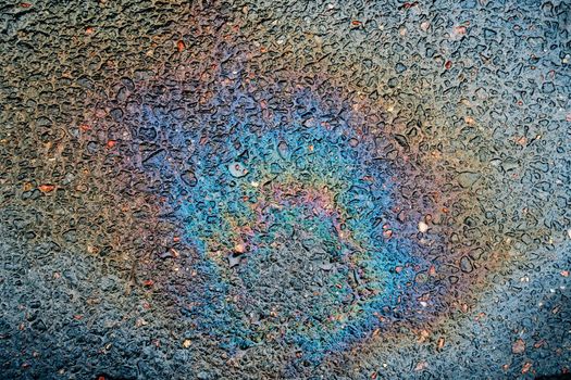 Traces and Stains of Oil or Gasoline on the Asphalt on the Road or Sidewalk