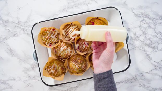 Flat lay. Step by step. Glazing cranberry muffins with an orange glaze.