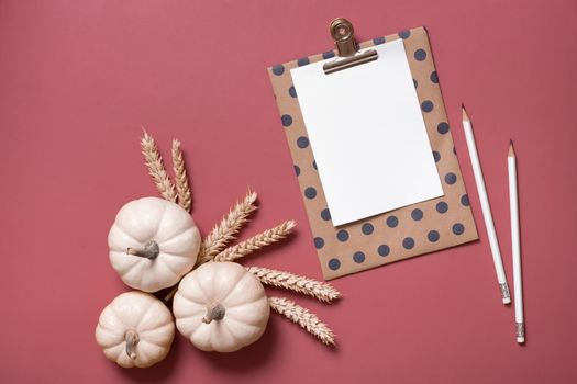 Blank tablet for text next to decorative pumpkins. Autumn theme mock up.