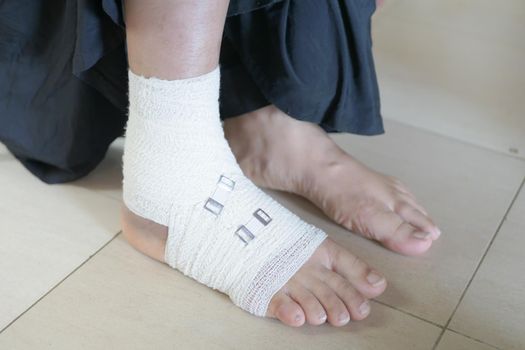 Woman with bandaged foot close up,