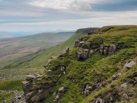 Dramatic view from The Nab to the cairns at High White Scar next to Wild Boar Fell, overlooking the Eden Valley, Cumbria, UK