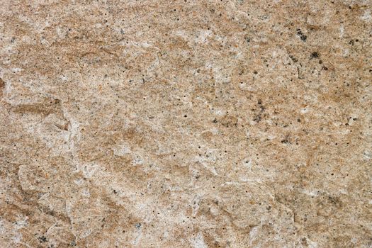 The texture of the granite stone surface in close-up. Texture for design with copy space.