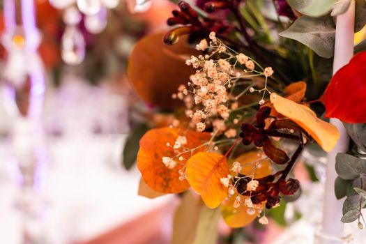 red autumn bouquet on the festive table.